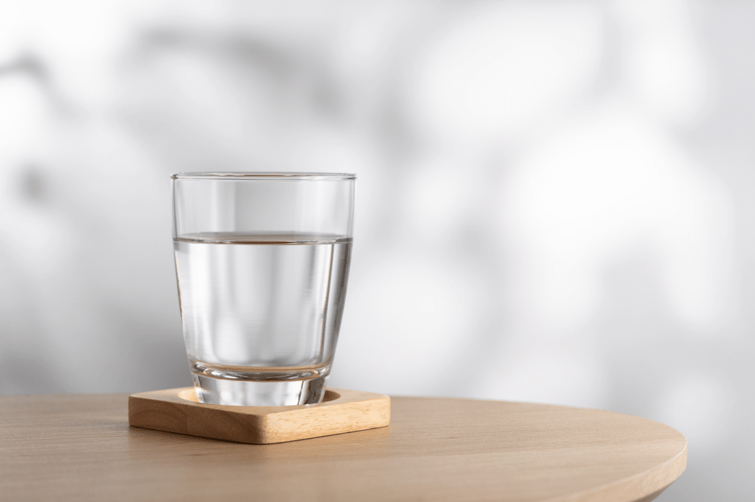 A glass of clear water from a water filter.