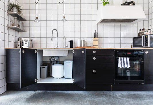 Close-up of a modern under-sink alkaline water system.