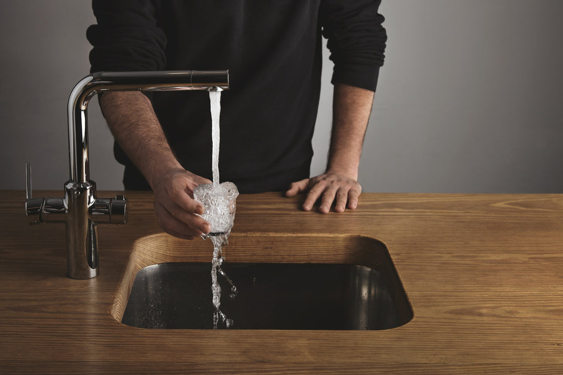 Man having a clean water from a faucet