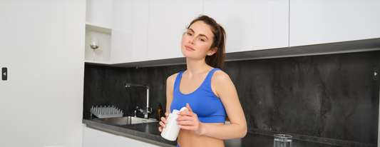 Modern woman comparing bottled water to filtered tap water in contemporary kitchen setting 