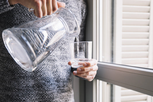 Woman enjoying clean, filtered water