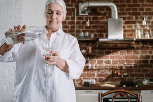 Tap water being poured into a glass.