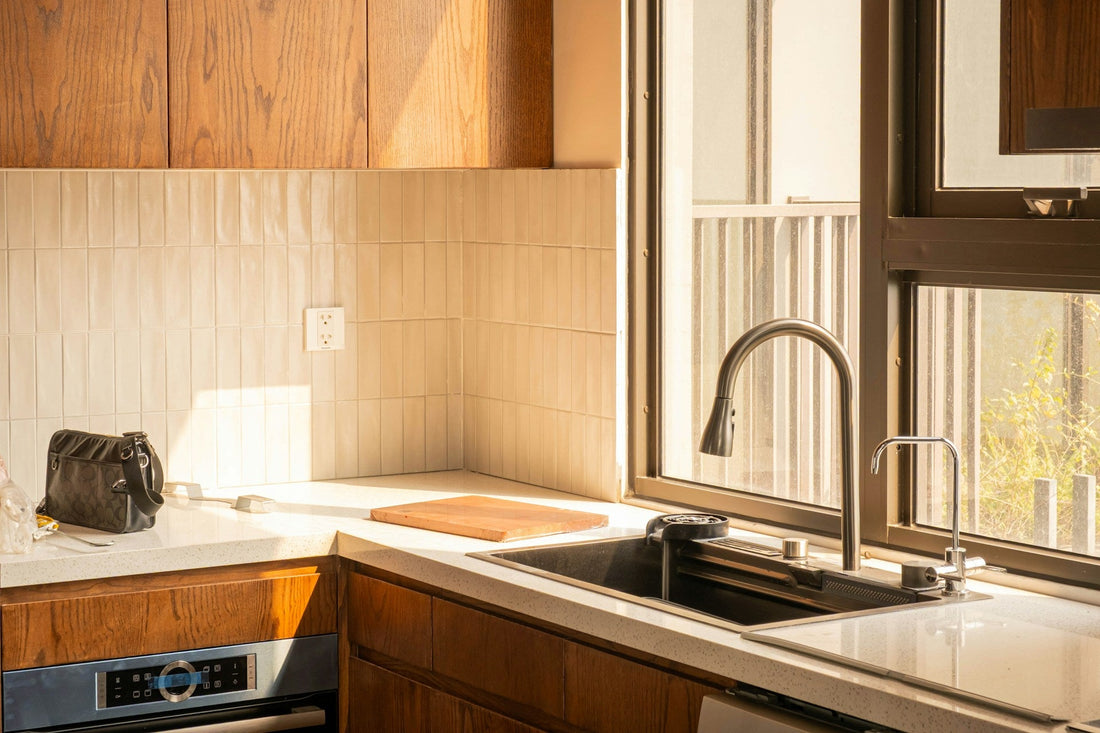 Modern countertop water filter system dispensing clean filtered water in contemporary kitchen setting