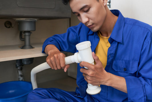 Image of a person checking the water filter system