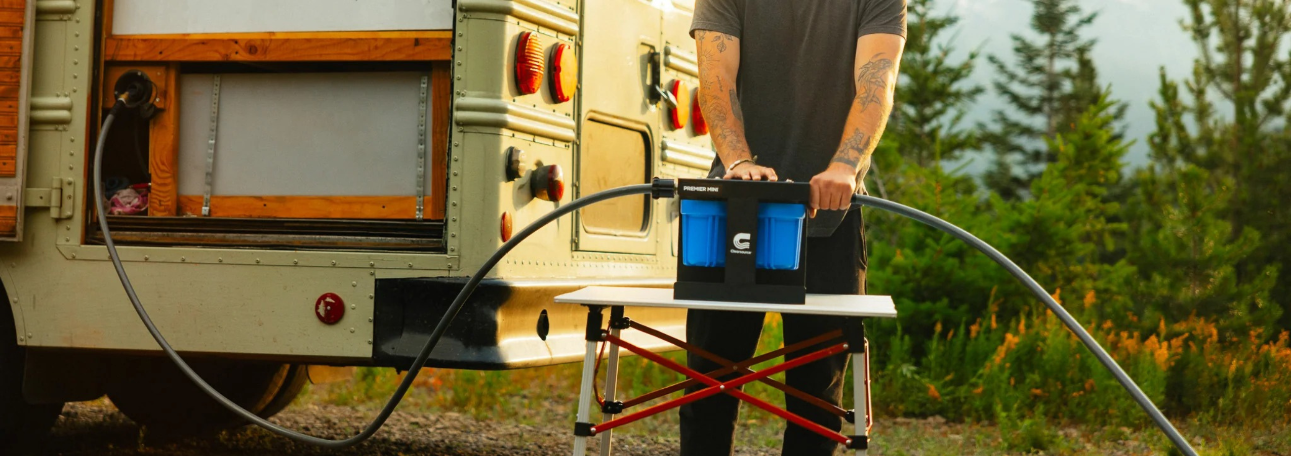 Man using water filter direct nomad and blutech water systems for RV water purification with clearsource filters